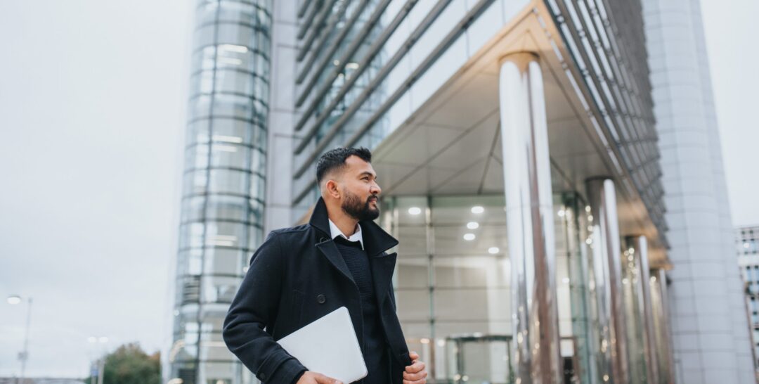 pexels-anete-lusina-5720972 Man in front of large building